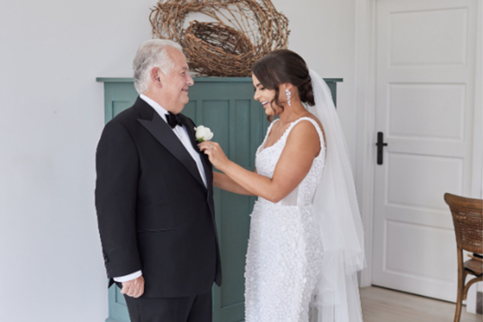 Father of the bride in his tailored suit with the groom