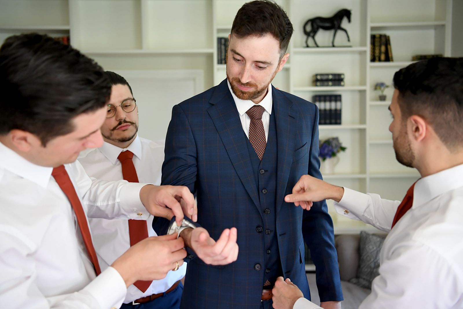 Groom in a blue windowpane-check three-piece suit