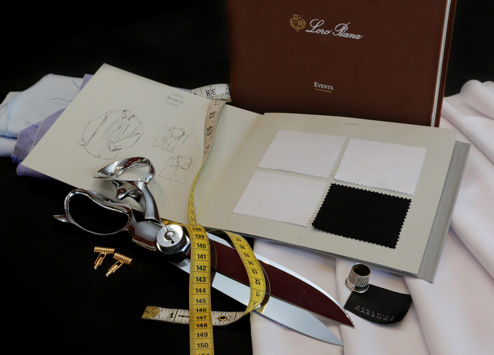Shirt-making — shears, tape measure and a shirting cloth book