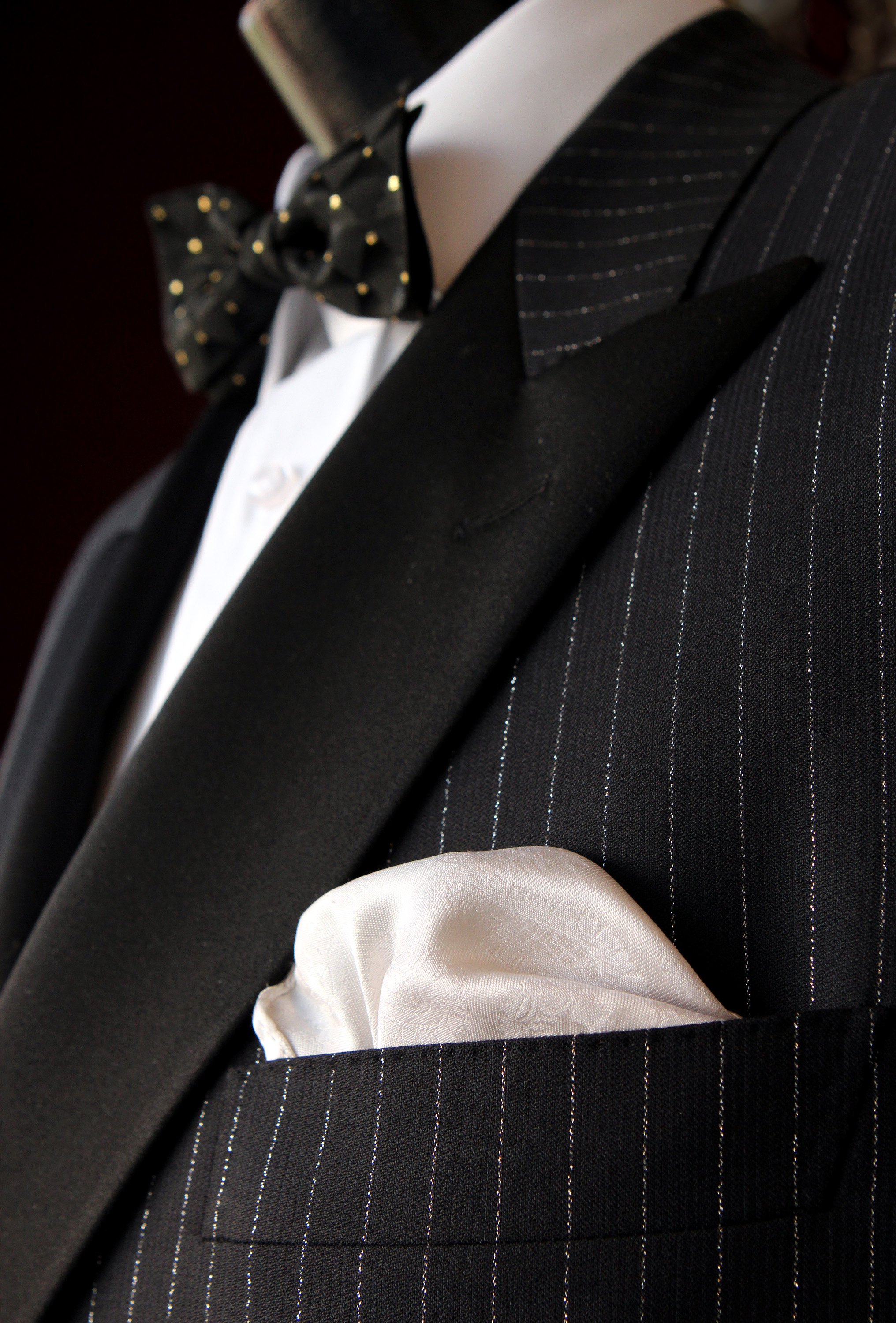 Pinstripe tuxedo with a spotted bow tie